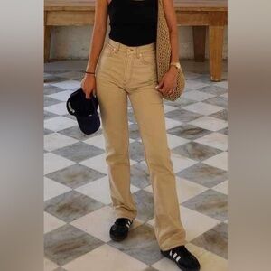 JACQUEMUS PANTS: Tan bootcut jeans with red contrast stitch